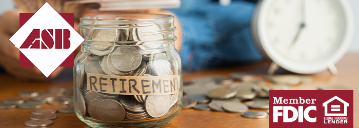 Jar full of quarters labeled Retirement